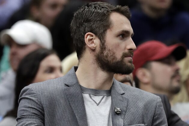 Cleveland Cavaliers' Kevin Love watches from the bench in the first half of an NBA basketball game against the Houston Rockets, Saturday, Feb. 3, 2018, in Cleveland. (AP Photo/Tony Dejak)