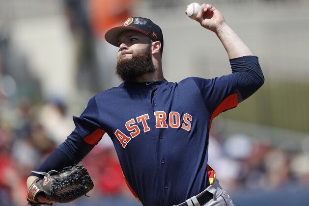 Houston Astros starting pitcher Dallas Keuchel (60) warms up before a spring training baseball game Thursday, March 15, 2018, in West Palm Beach, Fla. (AP Photo/John Bazemore)