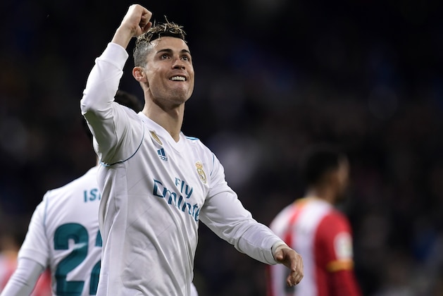 TOPSHOT - Real Madrid's Portuguese forward Cristiano Ronaldo celebrates his fourth goal during the Spanish League football match between Real Madrid CF and Girona FC at the Santiago Bernabeu stadium in Madrid on March 18, 2018. / AFP PHOTO / JAVIER SORIANO        (Photo credit should read JAVIER SORIANO/AFP/Getty Images)