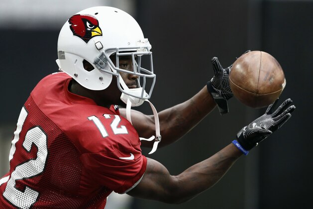 FILE - In this Aug. 17, 2017, file photo, Arizona Cardinals wide receiver John Brown (12) makes a catch during NFL football training camp in Glendale, Ariz. Brown, who played four seasons with Arizona, signed a one-year contract this week with the Baltimore Ravens. (AP Photo/Ross D. Franklin, File)