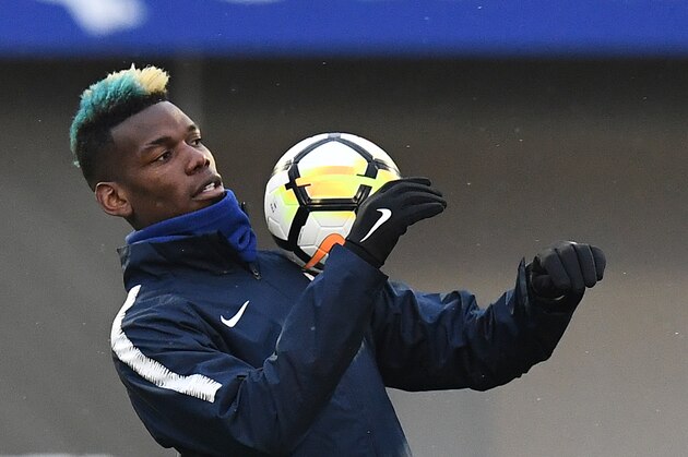 France's midfielder Paul Pogba controls the ball during a training session  in Clairefontaine-en-Yvelines, southwest of Paris, on March 19, 2018, as part of the team's preparation for the friendly football matches against Colombia and Russia.   / AFP PHOTO / FRANCK FIFE        (Photo credit should read FRANCK FIFE/AFP/Getty Images)