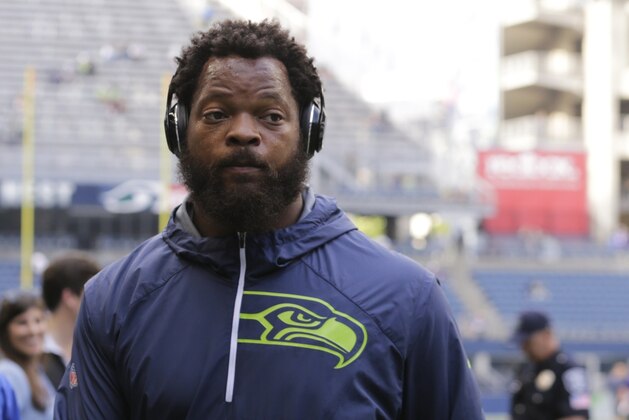 Seattle Seahawks defensive end Michael Bennett walks on the field during warmups before an NFL preseason football game against the Minnesota Vikings, Friday, Aug. 18, 2017, in Seattle. (AP Photo/Stephen Brashear)