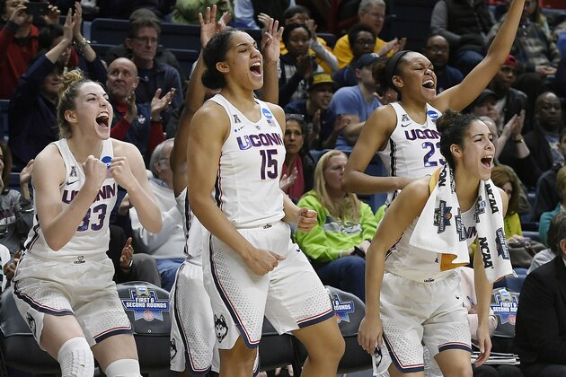 Connecticut's Katie Lou Samuelson (33), Gabby Williams (15), Kia Nurse (11), and Azurá Stevens (23) react on the sideline during the second half of a first-round game against Saint Francis (Pa.) in the NCAA women's college basketball tournament in in Storrs, Conn., Saturday, March 17, 2018. UConn won 140-52. (AP Photo/Jessica Hill)