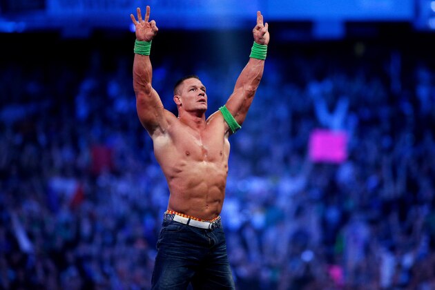 FILE- In this Sunday, April 6, 2014 file photo, John Cena celebrates his win during Wrestlemania XXX at the Mercedes-Benz Super Dome in New Orleans. World-famous WWE wrestlers such as John Cena, Shaemus and champion Randy Orton are in Saudi Arabia for three days of matches in the capital Riyadh. (Jonathan Bachman/AP Images for WWE, File)