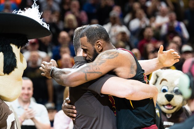 CLEVELAND, OH - MARCH 19: Former Cleveland Browns player Joe Thomas hugs LeBron James #23 of the Cleveland Cavaliers during a timeout during the first against the Milwaukee Bucks half at Quicken Loans Arena on March 19, 2018 in Cleveland, Ohio. NOTE TO USER: User expressly acknowledges and agrees that, by downloading and or using this photograph, User is consenting to the terms and conditions of the Getty Images License Agreement. (Photo by Jason Miller/Getty Images)