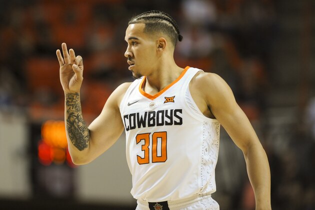 Oklahoma State guard Jeffrey Carroll gestures to a teammate during a NCAA college basketball game against TCU in Stillwater, Okla., Tuesday, Jan. 30, 2018.(AP Photo/Brody Schmidt)