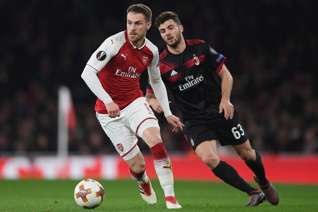 LONDON, ENGLAND - MARCH 15:  Aaron Ramsey of Arsenal runs with the ball during the UEFA Europa League Round of 16 second leg match between Arsenal and AC Milan at Emirates Stadium on March 15, 2018 in London, England.  (Photo by Shaun Botterill/Getty Images)