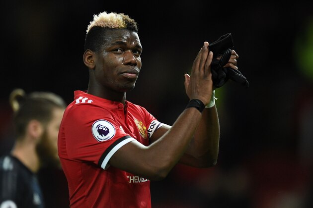 Manchester United's French midfielder Paul Pogba applauds as he leaves after the English Premier League football match between Manchester United and Southampton at Old Trafford in Manchester, north west England, on December 30, 2017. / AFP PHOTO / Oli SCARFF / RESTRICTED TO EDITORIAL USE. No use with unauthorized audio, video, data, fixture lists, club/league logos or 'live' services. Online in-match use limited to 75 images, no video emulation. No use in betting, games or single club/league/player publications.  /         (Photo credit should read OLI SCARFF/AFP/Getty Images)