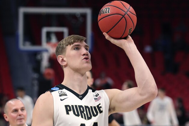 Purdue center Isaac Haas shoots during warmups before a second round game against Butler in the NCAA college basketball tournament, Sunday, March 18, 2018, in Detroit. A day after Isaac Haas' season was declared over, there's now a bit of mystery surrounding the status of Purdue's star center. That could be encouraging news for the second-seeded Boilermakers, who announced Friday that Haas would miss the rest of the NCAA Tournament with a broken elbow. On Saturday, a CBS reporter tweeted that Haas had practiced with the team, although coach Matt Painter tried to keep expectations low for a possible return. (AP Photo/Carlos Osorio)
