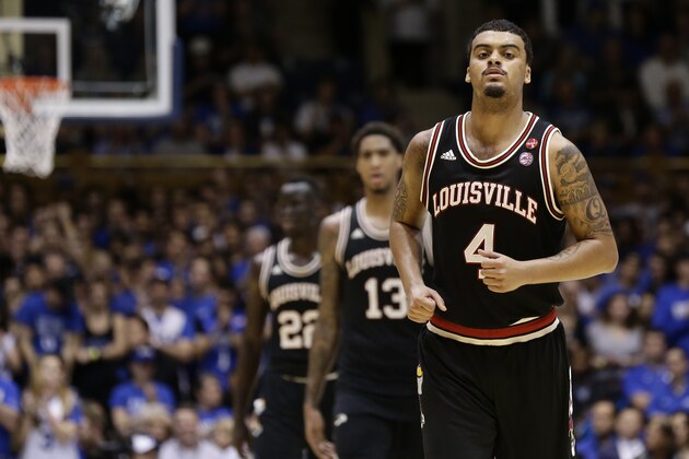 Louisville's Quentin Snider (4), Ray Spalding (13) and Deng Adel leave the floor during a timeout during the second half of an NCAA college basketball game against Duke in Durham, N.C., Wednesday, Feb. 21, 2018. Duke won 82-56. (AP Photo/Gerry Broome)