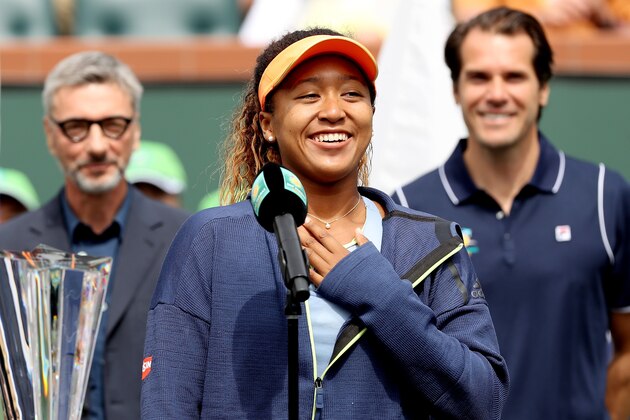 INDIAN WELLS, CA - MARCH 18:  Naomi Osaka of Japan addreses the audiance at the trophy ceremony after defeating Daria Kasatkina of Russia during the women's final on Day 14 of the BNP Paribas Open at the Indian Wells Tennis Garden on March 18, 2018 in Indian Wells, California.  (Photo by Matthew Stockman/Getty Images)