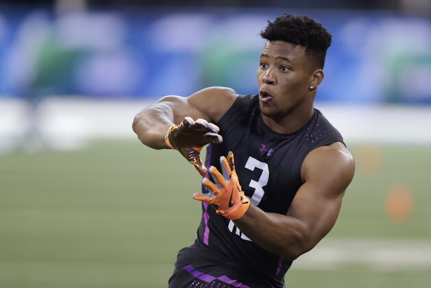 Penn State running back Saquon Barkley runs a drill during the NFL football scouting combine, Friday, March 2, 2018, in Indianapolis. (AP Photo/Darron Cummings)