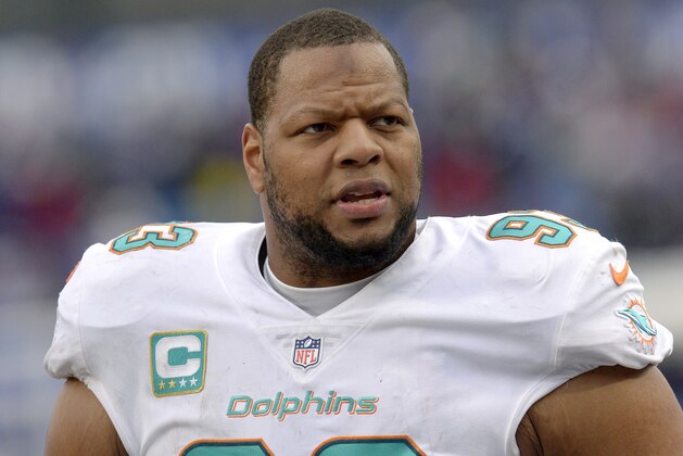 FILE - In this Dec. 17, 2017, file photo, Miami Dolphins defensive tackle Ndamukong Suh (93) looks on from the sideline during the first half of an NFL football game against the Buffalo Bills, in Orchard Park, N.Y. The Miami Dolphins appear ready to move on without their defensive anchor. Miami is discussing releasing five-time Pro Bowl tackle Ndamukong Suh when the NFL's new year begins Wednesday, a person familiar with the situation said Monday, March 12, 2018. The person said nothing has been finalized, and confirmed the conversations to The Associated Press on condition of anonymity because the Dolphins have not commented. (AP Photo/Adrian Kraus, File)