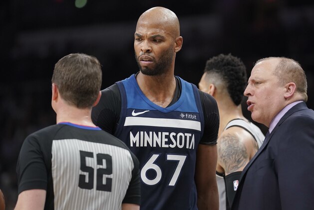 Minnesota Timberwolves forward Taj Gibson (67) glares at referee Scott Twardoski (52) after being called for a foul during the first half of an NBA basketball game against the San Antonio Spurs, Saturday, March 17, 2018, in San Antonio. San Antonio won 117-101. (AP Photo/Darren Abate)