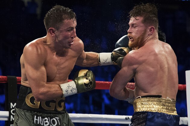 LAS VEGAS, NV - SEPTEMBER 16:  Gennady Golovkin punches Canelo Alvarez during their WBC, WBA and IBF middleweight championship bout at T-Mobile Arena on September 16, 2017 in Las Vegas, Nevada.  (Photo by Al Bello/Getty Images)
