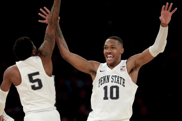 Penn State guard Tony Carr (10) celebrates with guard Jamari Wheeler (5) during a timeout in the second half against Northwestern in an NCAA college basketball game in the Big Ten men’s tournament Thursday, March 1, 2018, in New York. Penn State won 65-57. (AP Photo/Julie Jacobson)