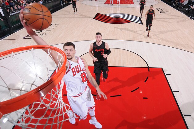 PORTLAND, OR - JANUARY 31: Zach LaVine #8 of the Chicago Bulls dunks against the Portland Trail Blazers on January 31, 2018 at the Moda Center in Portland, Oregon. NOTE TO USER: User expressly acknowledges and agrees that, by downloading and or using this Photograph, user is consenting to the terms and conditions of the Getty Images License Agreement. Mandatory Copyright Notice: Copyright 2018 NBAE (Photo by Sam Forencich/NBAE via Getty Images)