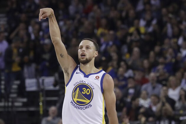 Golden State Warriors guard Stephen Curry (30) reacts after scoring against the Brooklyn Nets during the first half of an NBA basketball game in Oakland, Calif., Tuesday, March 6, 2018. (AP Photo/Jeff Chiu)
