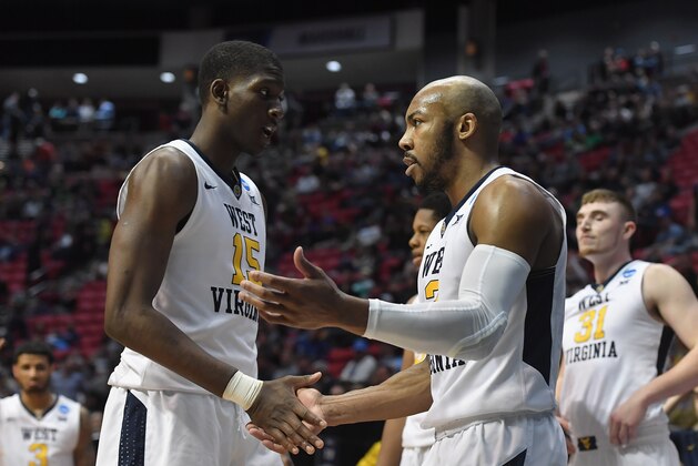 SAN DIEGO, CA - MARCH 18:  Lamont West #15 and Jevon Carter #2 of the West Virginia Mountaineers show comaraderie against the Marshall Thundering Herd in the second half during the second round of the 2018 NCAA Men's Basketball Tournament at Viejas Arena on March 18, 2018 in San Diego, California. The West Virginia Mountaineers won 94-71. (Photo by Donald Miralle/Getty Images)
