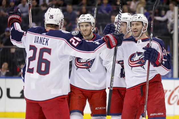 The Columbus Blue Jackets celebrate a goal by center Alexander Wennberg (10) against the New York Rangers during the first period of an NHL hockey game Tuesday, March 20, 2018, in New York. (AP Photo/Julie Jacobson)