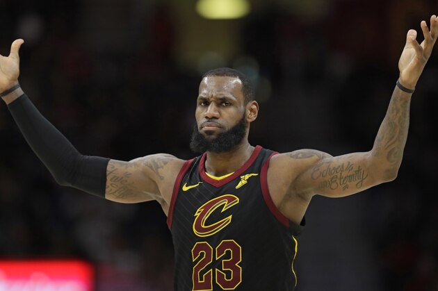 Cleveland Cavaliers' LeBron James reacts in the second half of an NBA basketball game against the Milwaukee Bucks, Monday, March 19, 2018, in Cleveland. (AP Photo/Tony Dejak)