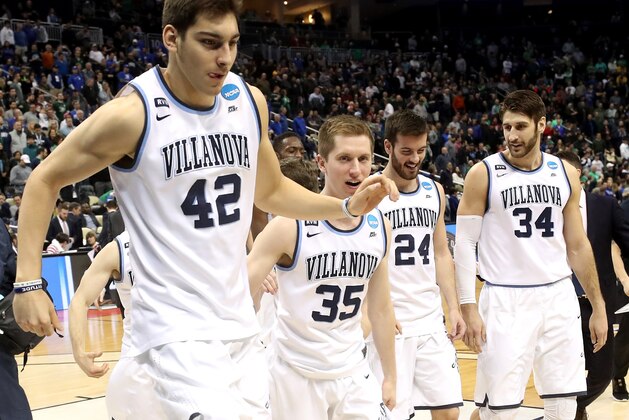 PITTSBURGH, PA - MARCH 17:  Dylan Painter #42, Matt Kennedy #35, Tom Leibig #24 and Tim Delaney #34 of the Villanova Wildcats react after defeating the Alabama Crimson Tide in the second round of the 2018 NCAA Men's Basketball Tournament at PPG PAINTS Arena on March 17, 2018 in Pittsburgh, Pennsylvania.  (Photo by Rob Carr/Getty Images)