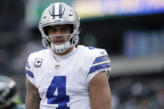 Dallas Cowboys' Dak Prescott walks the field during the first half of an NFL football game against the Philadelphia Eagles, Sunday, Dec. 31, 2017, in Philadelphia. (AP Photo/Michael Perez)
