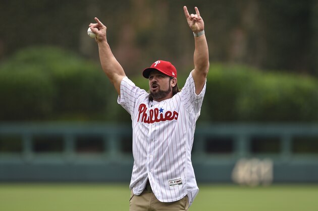 WWE superstar A.J. Styles throws out the ceremonial opening pitch prior to a baseball game between the Philadelphia Phillies and the Milwaukee Brewers, Sunday, July 23, 2017, in Philadelphia. (AP Photo/Derik Hamilton)