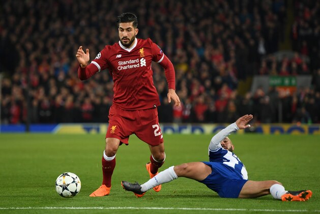 LIVERPOOL, ENGLAND - MARCH 06: Emre Can of Liverpool is tackled by Maximiliano of FC Porto during the UEFA Champions League Round of 16 Second Leg match between Liverpool and FC Porto at Anfield on March 6, 2018 in Liverpool, United Kingdom.  (Photo by Shaun Botterill/Getty Images)
