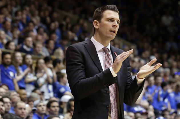 Louisville interim coach David Padgett encourages his players during the second half of an NCAA college basketball game against Duke in Durham, N.C., Wednesday, Feb. 21, 2018. Duke won 82-56. (AP Photo/Gerry Broome)