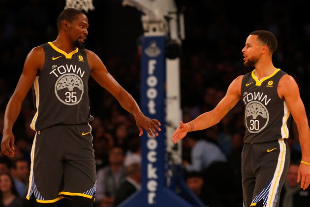 NEW YORK, NY - FEBRUARY 26:  (NEW YORK DAILIES OUT)    Stephen Curry #30 and Kevin Durant #35 of the Golden State Warriors in action against the New York Knicks at Madison Square Garden on February 26, 2018 in New York City. The Warriors defeated the Knicks 125-111. NOTE TO USER: User expressly acknowledges and agrees that, by downloading and/or using this Photograph, user is consenting to the terms and conditions of the Getty Images License Agreement.  (Photo by Jim McIsaac/Getty Images)