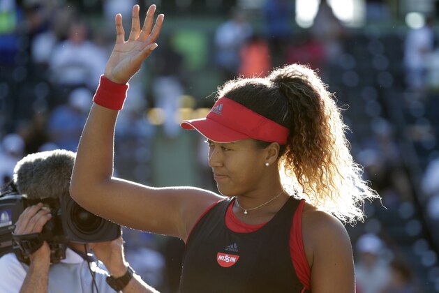 Naomi Osaka, of Japan, waves after defeating Serena Williams during the Miami Open tennis tournament, Wednesday, March 21, 2018, in Key Biscayne, Fla. Osaka won 6-3, 6-2. (AP Photo/Lynne Sladky)