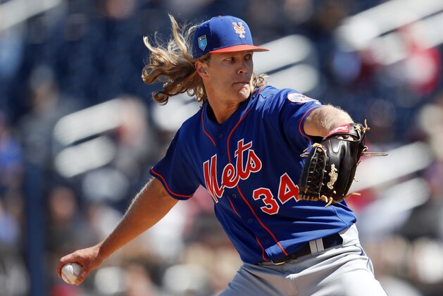 New York Mets starting pitcher Noah Syndergaard (34) works in the second inning of a spring training baseball game against the Washington Nationals Thursday, March 8, 2018, in West Palm Beach, Fla. (AP Photo/John Bazemore)