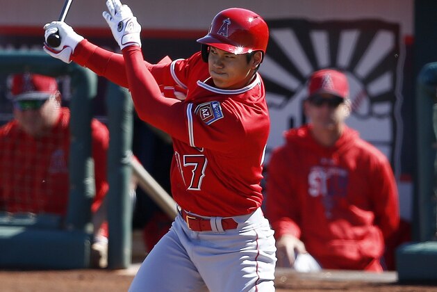 Los Angeles Angels designated hitter Shohei Ohtani, of Japan, hits an infield ground ball during the fourth inning of a spring training baseball game against the Cincinnati Reds, Monday, March 5, 2018, in Goodyear, Ariz. (AP Photo/Ross D. Franklin)