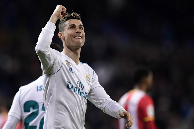 TOPSHOT - Real Madrid's Portuguese forward Cristiano Ronaldo celebrates his fourth goal during the Spanish League football match between Real Madrid CF and Girona FC at the Santiago Bernabeu stadium in Madrid on March 18, 2018. / AFP PHOTO / JAVIER SORIANO        (Photo credit should read JAVIER SORIANO/AFP/Getty Images)
