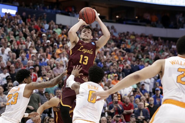 Loyola-Chicago guard Clayton Custer (13) shoots over Tennessee's Jordan Bowden (23) and Jordan Bone (0) and scores in the final seconds of a second-round game at the NCAA men's college basketball tournament in Dallas, Saturday, March 17, 2018. The shot helped Loyola to a 63-62 win. (AP Photo/Tony Gutierrez)