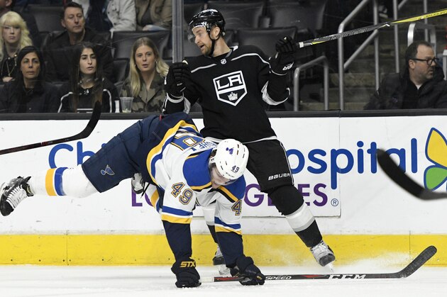 St. Louis Blues center Ivan Barbashev, of Russia, (49) falls to the ice against Los Angeles Kings center Jeff Carter (77) during a NHL hockey game, Saturday, March 10, 2018, in Los Angeles. The Blues won 7-2(AP Photo/John McCoy)