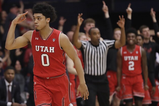 Utah's Sedrick Barefield (0) signals after making a 3-point basket against Saint Mary's during overtime in an NCAA college basketball game in the quarterfinals of the NIT, Wednesday, March 21, 2018, in Moraga, Calif. (AP Photo/Marcio Jose Sanchez)