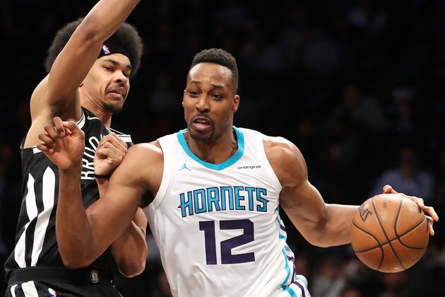 NEW YORK, NY - MARCH 21: Dwight Howard #12 of the Charlotte Hornets works toward the basket against Jarrett Allen #31 of the Brooklyn Nets in the second quarter during their game at Barclays Center on March 21, 2018 in the Brooklyn borough of New York City. NOTE TO USER: User expressly acknowledges and agrees that, by downloading and or using this photograph, User is consenting to the terms and conditions of the Getty Images License Agreement.  (Photo by Abbie Parr/Getty Images)