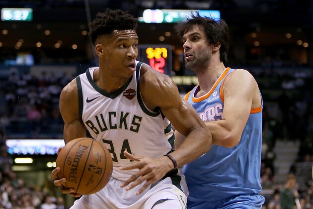 MILWAUKEE, WI - MARCH 21:  Giannis Antetokounmpo #34 of the Milwaukee Bucks dribbles the ball while being guarded by Milos Teodosic #4 of the Los Angeles Clippers in the second quarter at the Bradley Center on March 21, 2018 in Milwaukee, Wisconsin. NOTE TO USER: User expressly acknowledges and agrees that, by downloading and or using this photograph, User is consenting to the terms and conditions of the Getty Images License Agreement. (Photo by Dylan Buell/Getty Images)