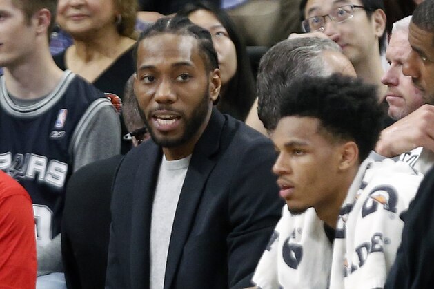 SAN ANTONIO,TX - FEBRUARY 28 :  Kawhi Leonard of the San Antonio Spurs sits on the bench in street clothes during a game against the New Orleans Pelicans at AT&T Center on February 28, 2018  in San Antonio, Texas.  NOTE TO USER: User expressly acknowledges and agrees that , by downloading and or using this photograph, User is consenting to the terms and conditions of the Getty Images License Agreement. (Photo by Ronald Cortes/Getty Images)