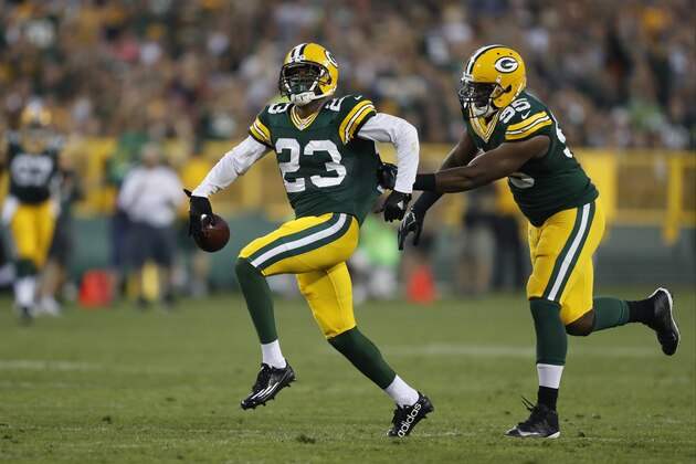 Green Bay Packers cornerback Damarious Randall (23), left, celebrates an interception with teammate Green Bay Datone Jones (95)during the first half of an NFL preseason football game against the Oakland Raiders in Green Bay, Wis., Thursday, Aug. 18, 2016. (AP Photo/Matt Ludtke)