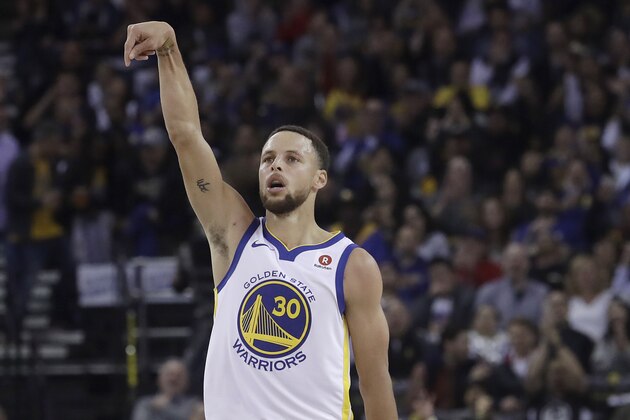 Golden State Warriors guard Stephen Curry (30) reacts after scoring against the Brooklyn Nets during the first half of an NBA basketball game in Oakland, Calif., Tuesday, March 6, 2018. (AP Photo/Jeff Chiu)