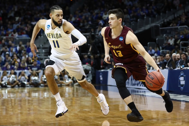 ATLANTA, GA - MARCH 22: Clayton Custer #13 of the Loyola Ramblers is defended by Cody Martin #11 of the Nevada Wolf Pack in the second half during the 2018 NCAA Men's Basketball Tournament South Regional at Philips Arena on March 22, 2018 in Atlanta, Georgia.  (Photo by Ronald Martinez/Getty Images)