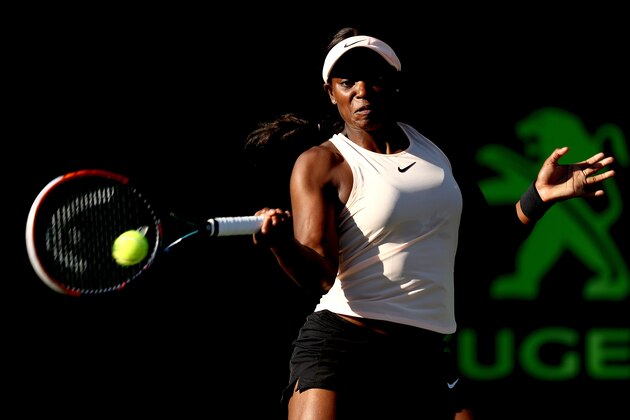 KEY BISCAYNE, FL - MARCH 22:  Sloane Stephens returns a shot to Ajia Tomljanovic of Australia during Day 4 of the Miami Open at the Crandon Park Tennis Center on March 22, 2018 in Key Biscayne, Florida.  (Photo by Matthew Stockman/Getty Images)
