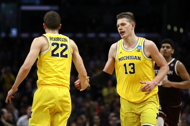 LOS ANGELES, CA - MARCH 22: Duncan Robinson #22 and Moritz Wagner #13 of the Michigan Wolverines celebrate the play against the Texas A&M Aggies during the first half in the 2018 NCAA Men's Basketball Tournament West Regional at Staples Center on March 22, 2018 in Los Angeles, California.  (Photo by Ezra Shaw/Getty Images)