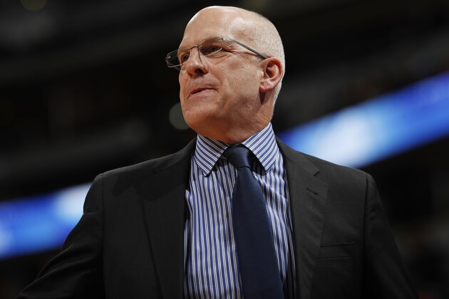 Phoenix Suns coach Jay Triano watches his team play the Denver Nuggets during the first half of an NBA basketball game Friday, Jan. 19, 2018, in Denver. (AP Photo/David Zalubowski)