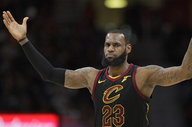 Cleveland Cavaliers' LeBron James reacts in the second half of an NBA basketball game against the Milwaukee Bucks, Monday, March 19, 2018, in Cleveland. (AP Photo/Tony Dejak)