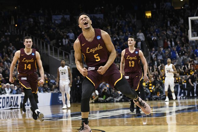 Loyola-Chicago guard Marques Townes (5) celebrates his three-point shot late in the game against Nevada during the second half of a regional semifinal NCAA college basketball game, Thursday, March 22, 2018, in Atlanta. Loyola-Chicago won 69-68. (AP Photo/John Amis)