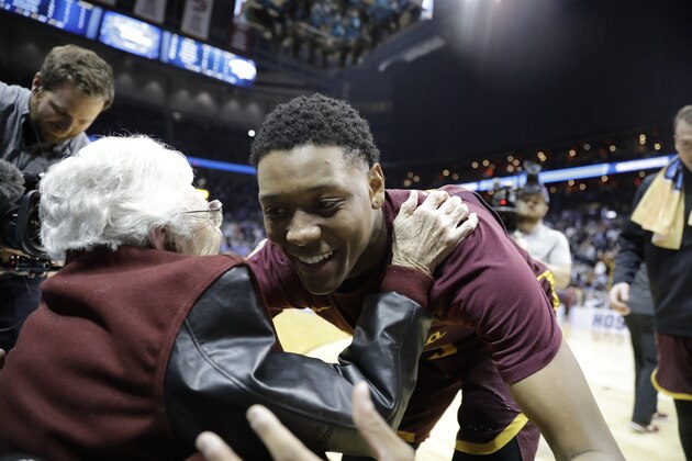 Sister Jean Dolores Schmidt embraces Loyola-Chicago guard Cameron Satterwhite after a regional semifinal NCAA college basketball game against Nevada, Thursday, March 22, 2018, in Atlanta. Loyola-Chicago won 69-68. (AP Photo/David Goldman)